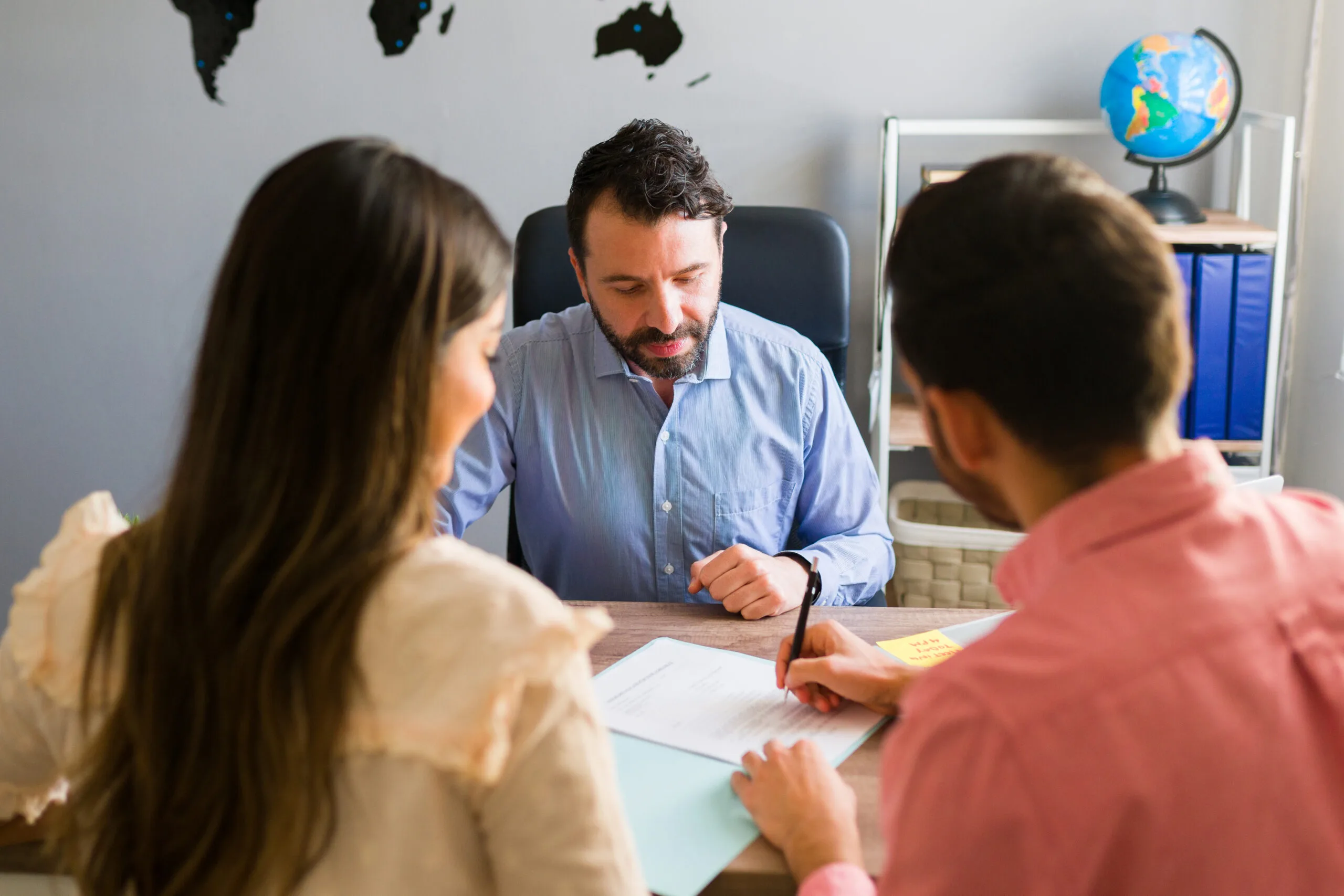 you got deal young man signing sales contract holiday vacation with his wife sales representative closing deal timeshare sale with some customers travel agency 1 scaled